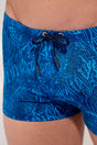 Close-up view of a men model wearing HO blue print  Swim Shorts