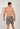 Back view of a men model wearing HO multico print  Beach Boxer