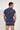 Back view of a men model wearing HO blue print  Tee-Shirt V Neck