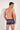 Back view of a men model wearing HO blue print  Trunk