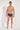 Full-body view of a men model wearing HO blue print  Trunk