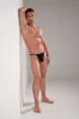 Full-body view of a men model wearing HO black  G-String