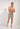 Full-body view of a men model wearing HO green print  Beach Boxer