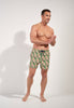 Full-body view of a men model wearing HO green print  Beach Boxer