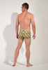 General view of a men model wearing HO green print  Swim Shorts