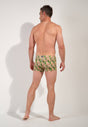 General view of a men model wearing HO green print  Swim Shorts