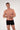 General view of a men model wearing HO black/black/black cotton Boxer Briefs HO1 3p