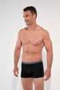 General view of a men model wearing HO black/black/black cotton Boxer Briefs HO1 3p
