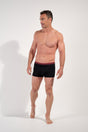 General view of a men model wearing HO black/black/black cotton Boxer Briefs HO1 3p