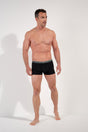 General view of a men model wearing HO black/black/black cotton Boxer Briefs HO1 3p