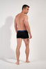 General view of a men model wearing HO black/black/black cotton Boxer Briefs HO1 3p