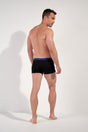 General view of a men model wearing HO black/black/black cotton Boxer Briefs HO1 3p