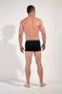 General view of a men model wearing HO black/black/black cotton Boxer Briefs HO1 3p