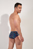 Back view of a men model wearing HO navy print  Swim Mini Briefs