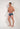 Full-body view of a men model wearing HO navy print  Swim Trunk