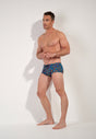 Full-body view of a men model wearing HO navy print  Swim Trunk
