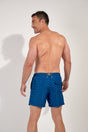 Back view of a men model wearing HO navy print  Beach Boxer