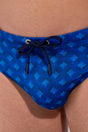 Close-up view of a men model wearing HO navy print  Swim Mini Briefs