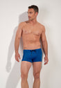 Front view of a men model wearing HO navy print  Swim Shorts