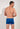 Back view of a men model wearing HO navy print  Swim Shorts