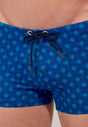 Close-up view of a men model wearing HO navy print  Swim Shorts