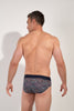 Back view of a men model wearing HO navy print modal/viscose/tencel Mini Briefs
