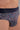 Close-up view of a men model wearing HO navy print modal/viscose/tencel Mini Briefs
