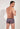 Back view of a men model wearing HO navy print  Trunk
