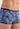 Close-up view of a men model wearing HO blue print  Trunk