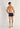 Full-body view of a men model wearing HO navy print modal/viscose/tencel Comfort Boxer Briefs