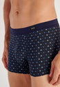 Close-up view of a men model wearing HO navy print modal/viscose/tencel Comfort Boxer Briefs