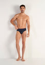 Full-body view of a men model wearing HO navy print modal/viscose/tencel Comfort Briefs