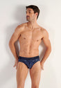 Front view of a men model wearing HO navy print modal/viscose/tencel Mini Briefs