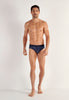 Full-body view of a men model wearing HO navy print modal/viscose/tencel Mini Briefs