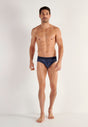 Full-body view of a men model wearing HO navy print modal/viscose/tencel Mini Briefs