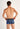 Back view of a men model wearing HO blue print  Trunk