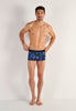 Full-body view of a men model wearing HO blue print  Trunk