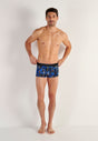 Full-body view of a men model wearing HO blue print  Trunk