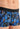 Close-up view of a men model wearing HO blue print  Trunk