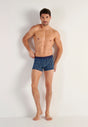 Full-body view of a men model wearing HO blue print  Boxer Briefs HO1