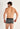 Back view of a men model wearing HO multico print  Trunk