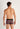 Back view of a men model wearing HO black/red  Trunk