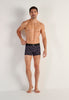 Full-body view of a men model wearing HO black print modal/viscose/tencel Boxer Briefs
