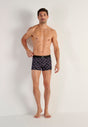Full-body view of a men model wearing HO black print modal/viscose/tencel Boxer Briefs