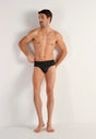 Full-body view of a men model wearing HO black print modal/viscose/tencel Briefs HO1