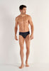 Full-body view of a men model wearing HO navy check modal/viscose/tencel Mini Briefs