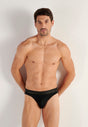 Front view of a men model wearing HO black cotton Mini Briefs
