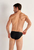 Back view of a men model wearing HO black cotton Mini Briefs