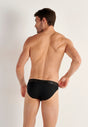 Back view of a men model wearing HO black cotton Mini Briefs