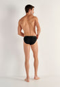 General view of a men model wearing HO black cotton Mini Briefs